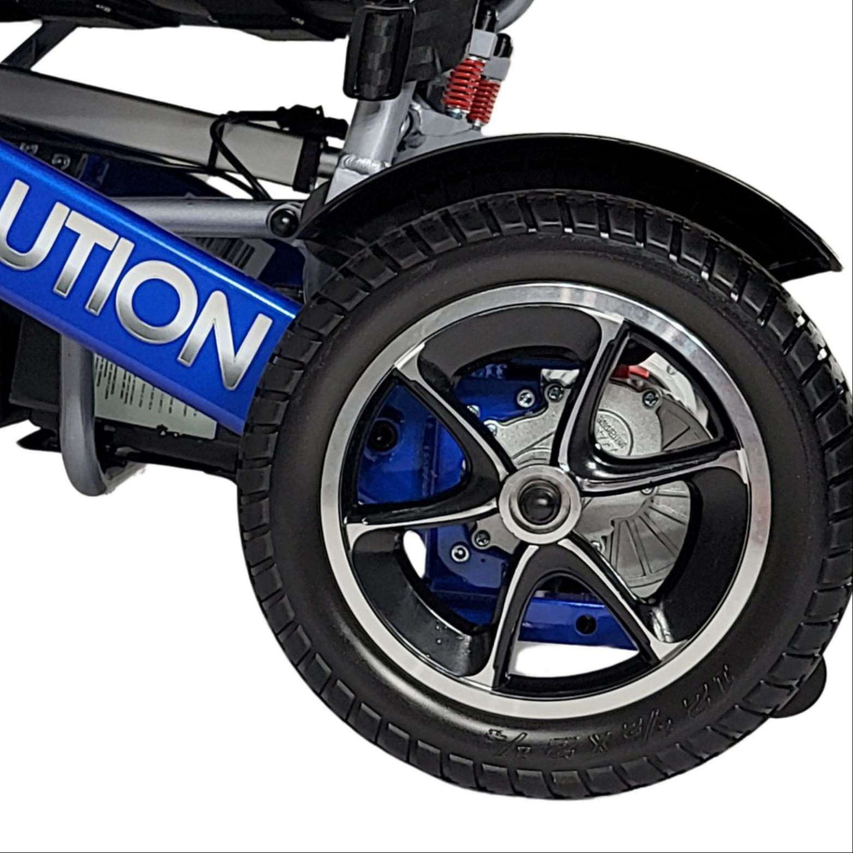 Folded Evolution electric wheelchair with 12.5-inch rear tires, showing its compact frame designed for easy transport and storage.